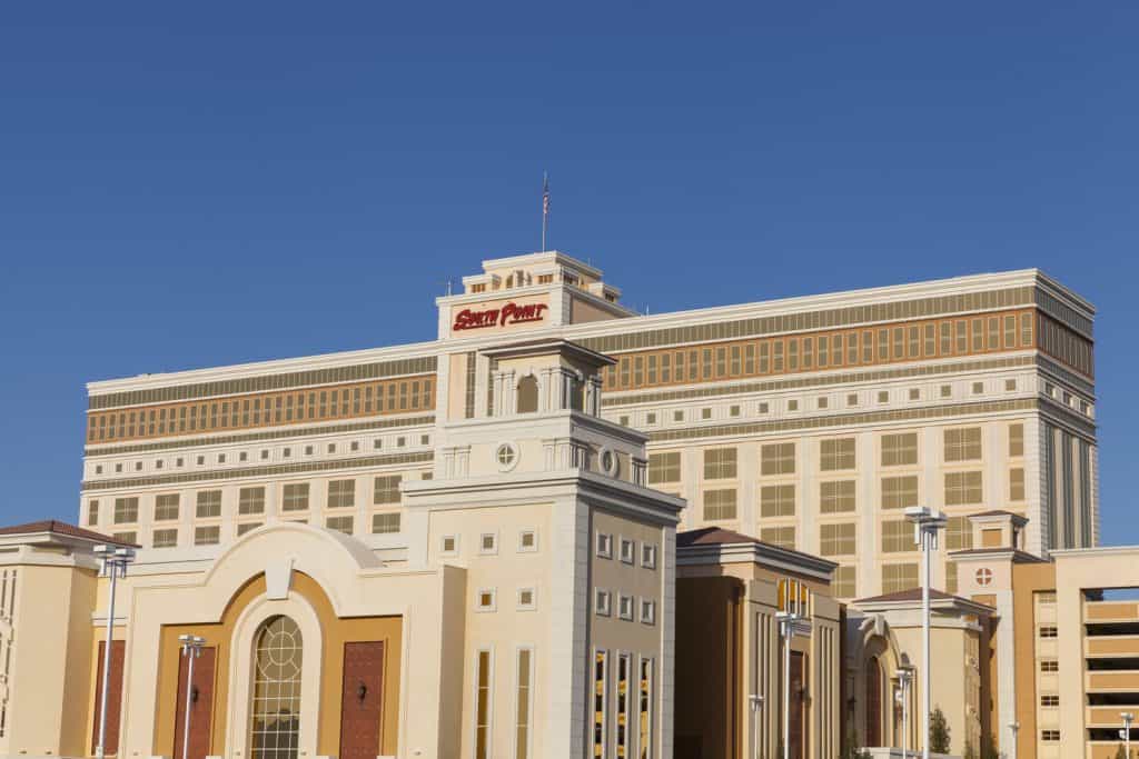 The front of a large resort on a clear, sunny day.