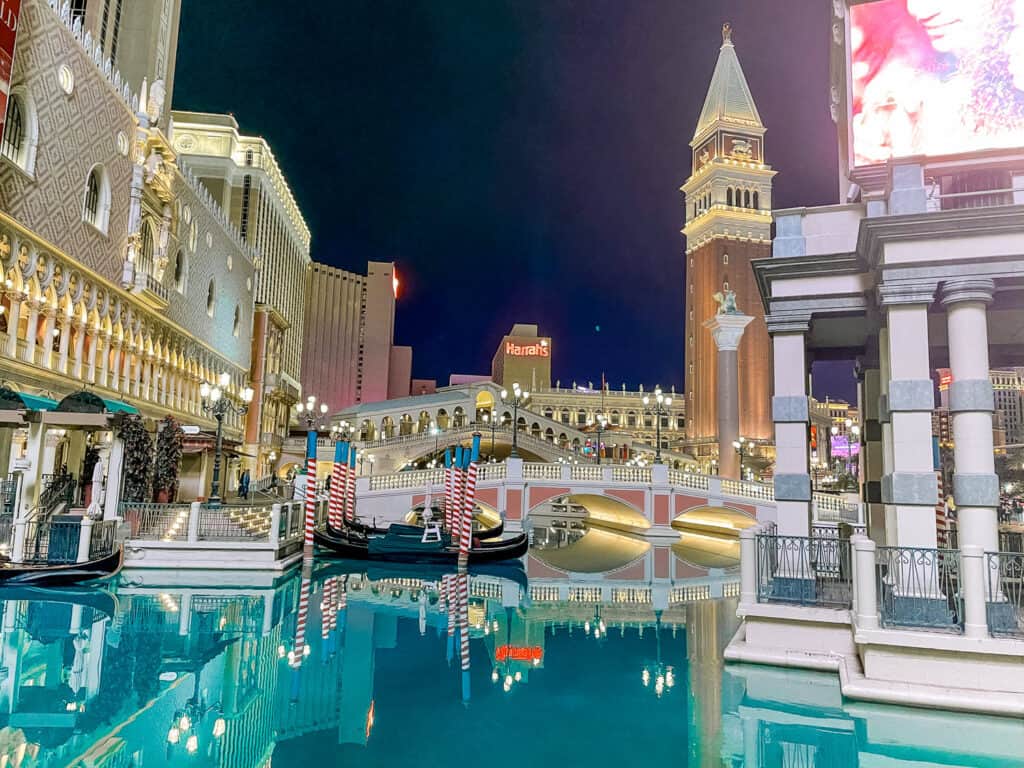 Exterior of The Venetian Las Vegas with empty gondolas docked.